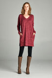 Tunic top featuring V neck, hidden pockets, and side slits