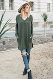 Tunic top featuring V neck, hidden pockets, and side slits
